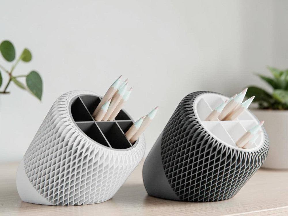 My Store 2 tilted lattice desk organizers in light grey and charcoal with divided interiors for office supplies.